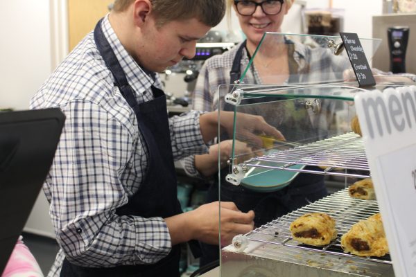 Learner serving sausage rolls