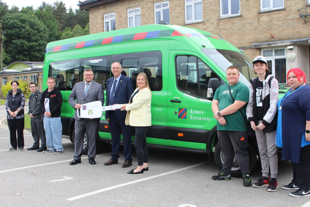 Portland learners and Principal Mark Dale receive a new minibus from Lord's Taverners